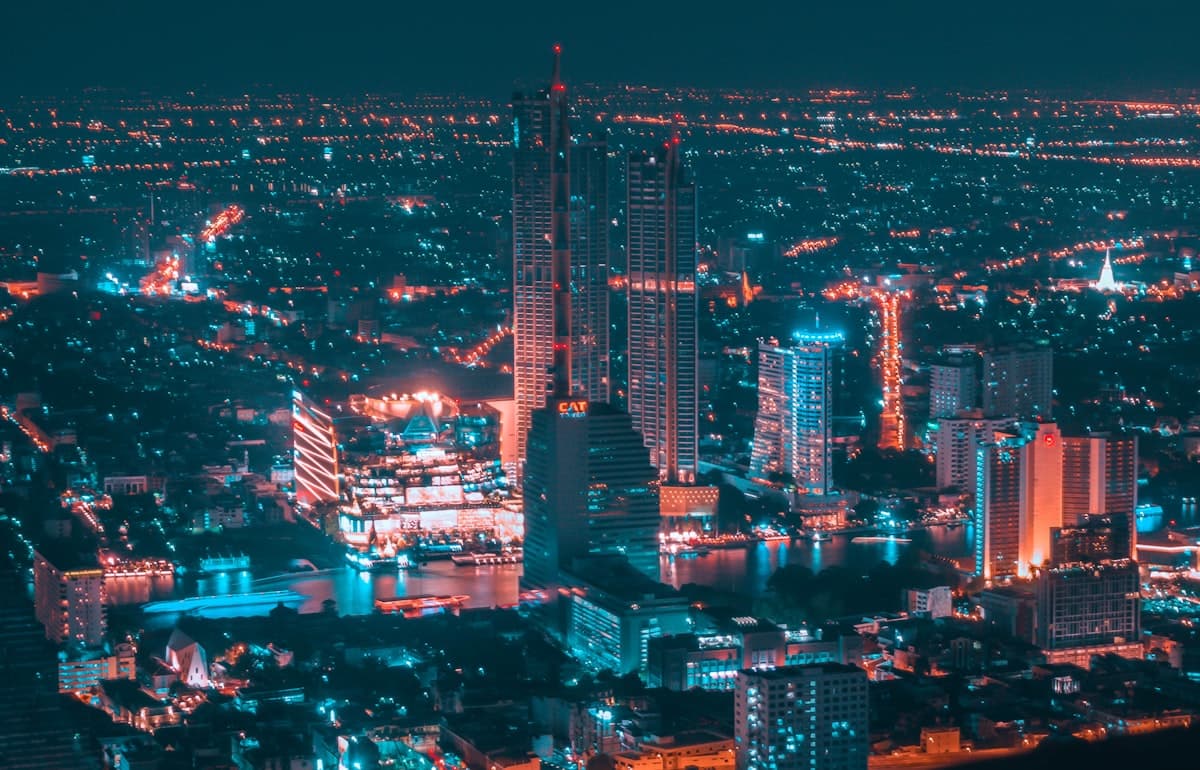 Aerial view of Bangkok's skyline and the Chao Phraya river lit up at night